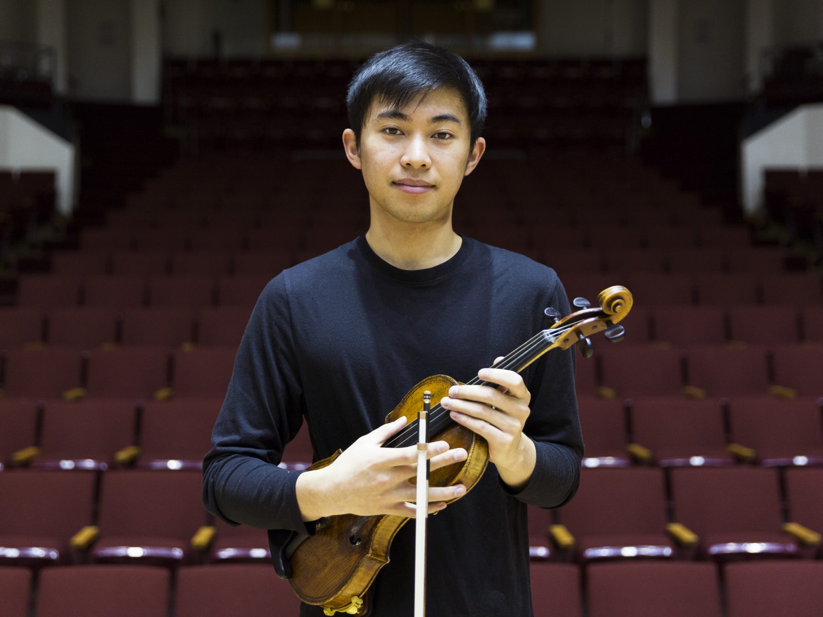 Luke Valmadrid poses with his violen