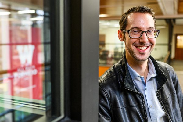 Brett Nachman poses in the Education Building.